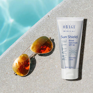 Obagi Sun Shield Matte Broad Spectrum SPF 5 Sunscreen from MyExceptionalSkinCare.com Bottle With Sunglasses